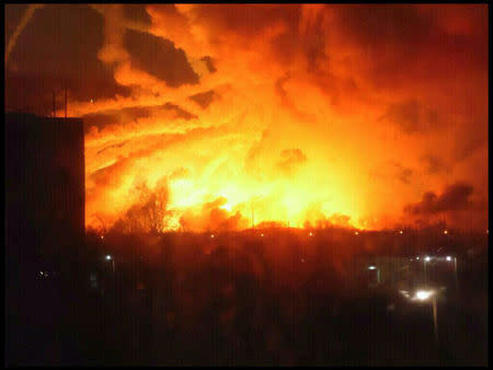 Smoke rises over a warehouse storing tank ammunition at a military base in the town of Balaklia (Balakleya), Kharkiv region, Ukraine, March 23, 2017. State Emergency Service of Ukraine/Handout via REUTERS
