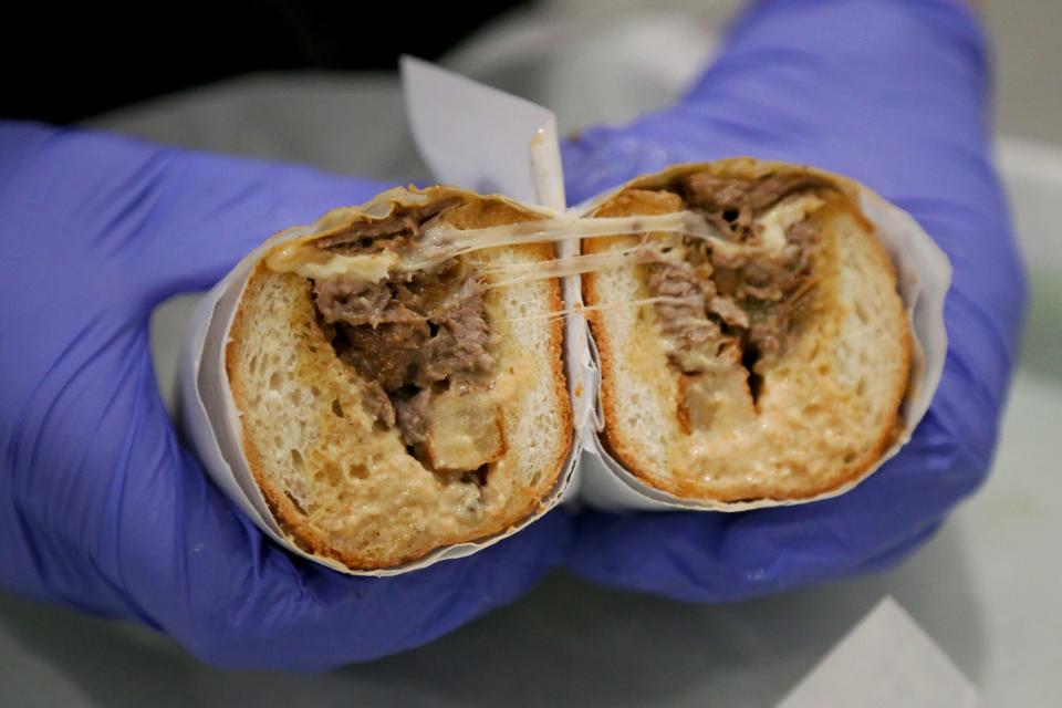 Brian Colford cooks up a sandwich called the Silly Philly at the Takeout Station in Exeter.