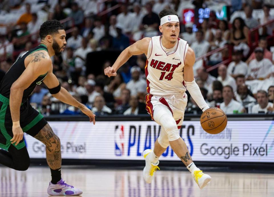 Miami Heat guard <a class="link " href="https://sports.yahoo.com/nba/players/6175/" data-i13n="sec:content-canvas;subsec:anchor_text;elm:context_link" data-ylk="slk:Tyler Herro;sec:content-canvas;subsec:anchor_text;elm:context_link;itc:0">Tyler Herro</a> (14) drives the ball as Boston Celtics forward <a class="link " href="https://sports.yahoo.com/nba/players/5765/" data-i13n="sec:content-canvas;subsec:anchor_text;elm:context_link" data-ylk="slk:Jayson Tatum;sec:content-canvas;subsec:anchor_text;elm:context_link;itc:0">Jayson Tatum</a> (0) defends in the first half of Game 4 of an NBA basketball first-round playoff series at Kaseya Center on April 29, 2024, in Miami. MATIAS J. OCNER/mocner@miamiherald.com