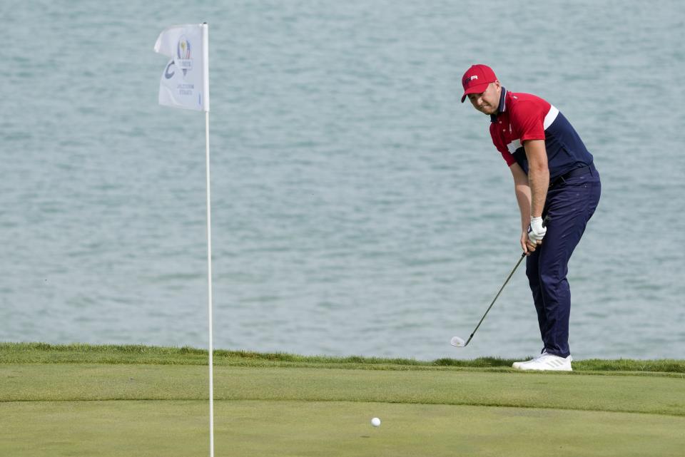 Team USA's Daniel Berger hits to the third green during a Ryder Cup singles match at the Whistling Straits Golf Course Sunday, Sept. 26, 2021, in Sheboygan, Wis. (AP Photo/Charlie Neibergall)