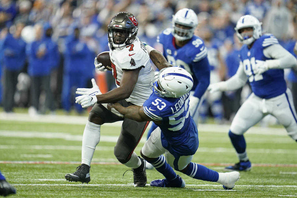 Tampa Bay Buccaneers' Leonard Fournette (7) is tackled by Indianapolis Colts' Darius Leonard (53) during the first half of an NFL football game, Sunday, Nov. 28, 2021, in Indianapolis. (AP Photo/Michael Conroy)