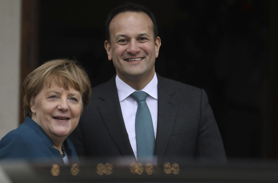 Irish Prime Minister Leo Varadkar and German Chancellor Angela Merkel smile at the waiting media outside Farmleigh House in Dublin, Ireland, Thursday, April 4, 2019. (AP Photo/Peter Morrison)