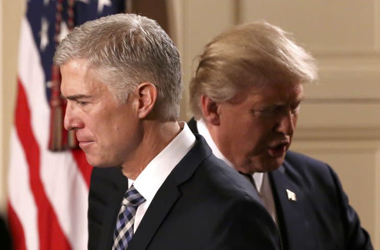 Trump steps back as Neil Gorsuch approaches the podium to speak after being nominated to be an associate justice of the U.S. Supreme Court at the White House, Jan. 31, 2017. (Carlos Barria/Reuters)