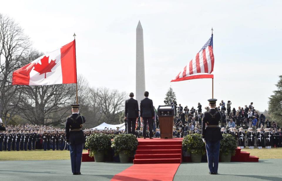 U.S. President Barack Obama, left, and Canadian Prime Minister Justin Trudeau stand for the playing of the national anthems during a state arrival ceremony on the South Lawn of the White House in Washington, D.C., on Thursday, March 10, 2016. THE CANADIAN PRESS/Paul Chiasson