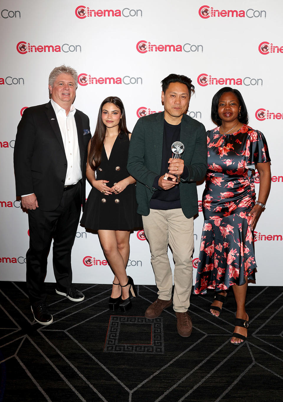 Michael O’Leary, President and CEO, National Association of Theatre Owners, Ariana Greenblatt, Jon M. Chu, recipient of the Martin Scorsese Legend Of Cinema Award, and Nekesa Mumbi Moody attend the Legend Of Cinema Luncheon during CinemaCon 2024 at Caesars Palace on April 11, 2024 in Las Vegas, Nevada.