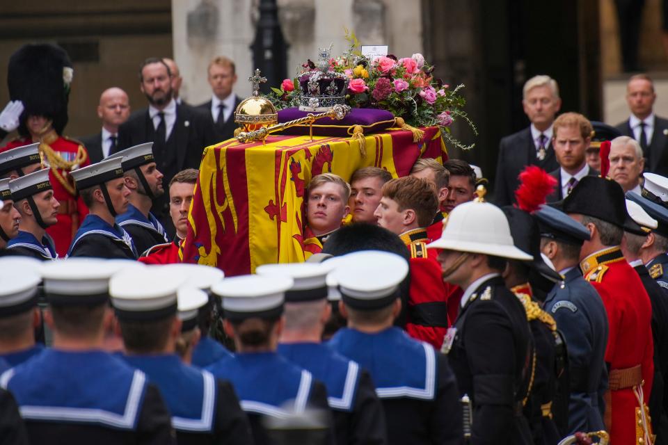The coffin of Queen Elizabeth II is placed on a gun carriage during her funeral service in Westminster Abbey in central London Monday Sept. 19, 2022.