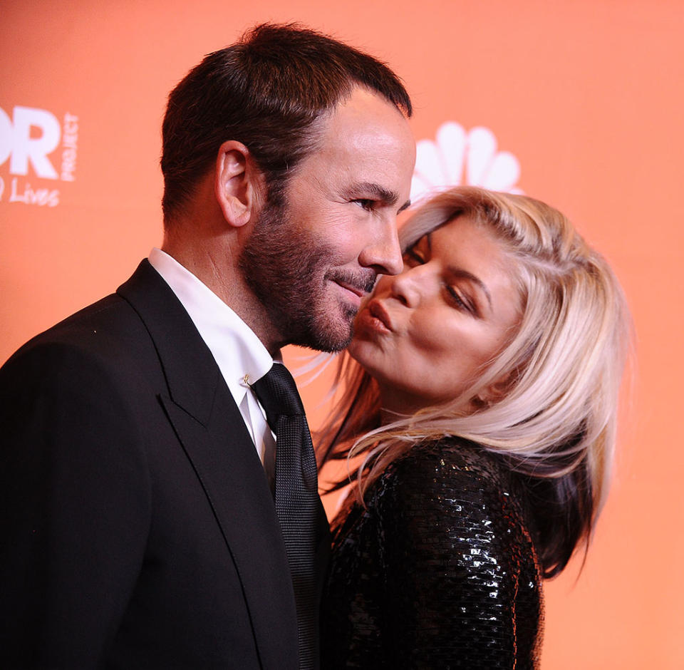 <p>The sexy singer smooched her date for the evening, designer Tom Ford, who accepted the Hero Award Sunday night at Trevor Project’s 2017 TrevorLIVE LA ceremony. The Trevor Project is a national advocacy group focused on LGBTQ youth suicide prevention. (Photo: Jason LaVeris/FilmMagic) </p>