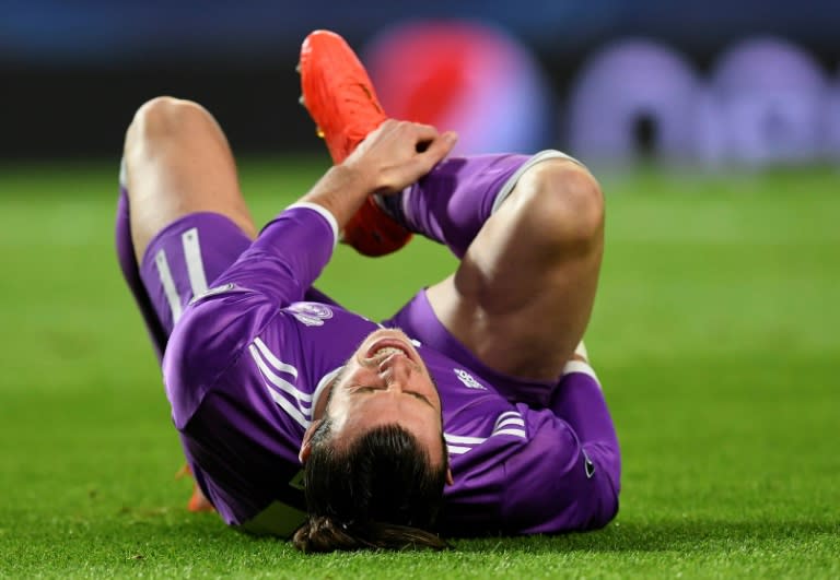 Gareth Bale grimaces as he lies on the pitch during Real Madrid's Champions League game against Sporting in Lisbon on November 22, 2016