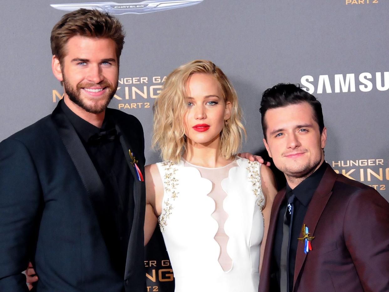 Liam Hemsworth, Jennifer Lawrence, and Josh Hutcherson at the 2015 premiere of "The Hunger Games Mockingjay: Part 2."