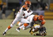 Dec 15, 2013; Pittsburgh, PA, USA; Cincinnati Bengals wide receiver Marvin Jones (82) runs with the ball as tackle Anthony Collins (73) blocks Pittsburgh Steelers strong safety Will Allen (20) during the third quarter at Heinz Field. The Steelers won 30-20. Mandatory Credit: Charles LeClaire-USA TODAY Sports