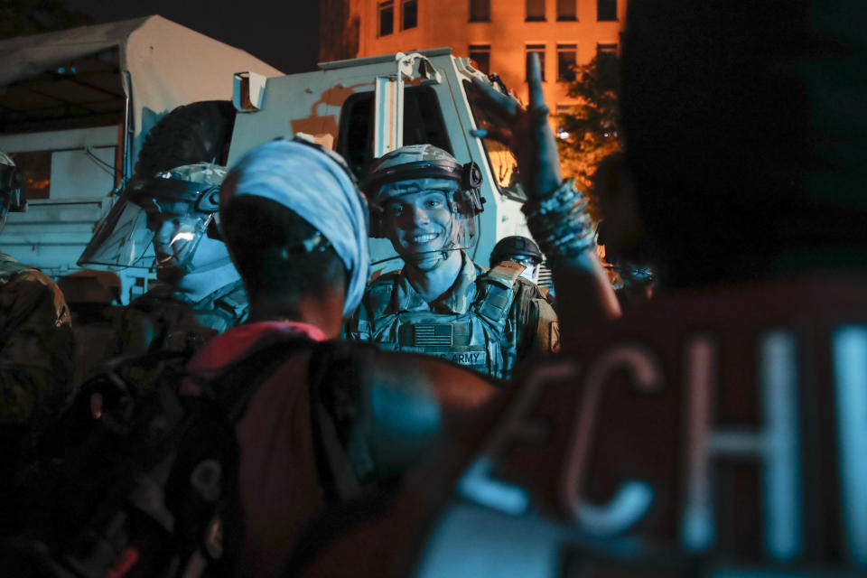 A South Carolina National Guard soldier stands on a police line as demonstrators gather to protest the death of George Floyd, Wednesday, June 3, 2020, near the White House in Washington. Floyd died after being restrained by Minneapolis police officers. (AP Photo/Carolyn Kaster)