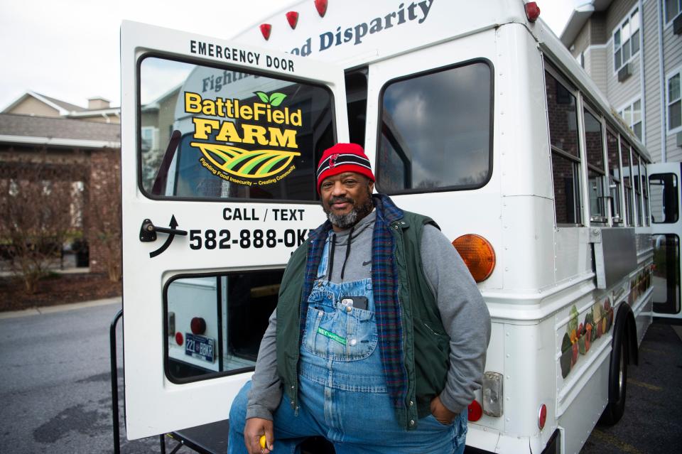 Chris Battle brings his veggie bus to the Five Points neighborhood earlier this month.