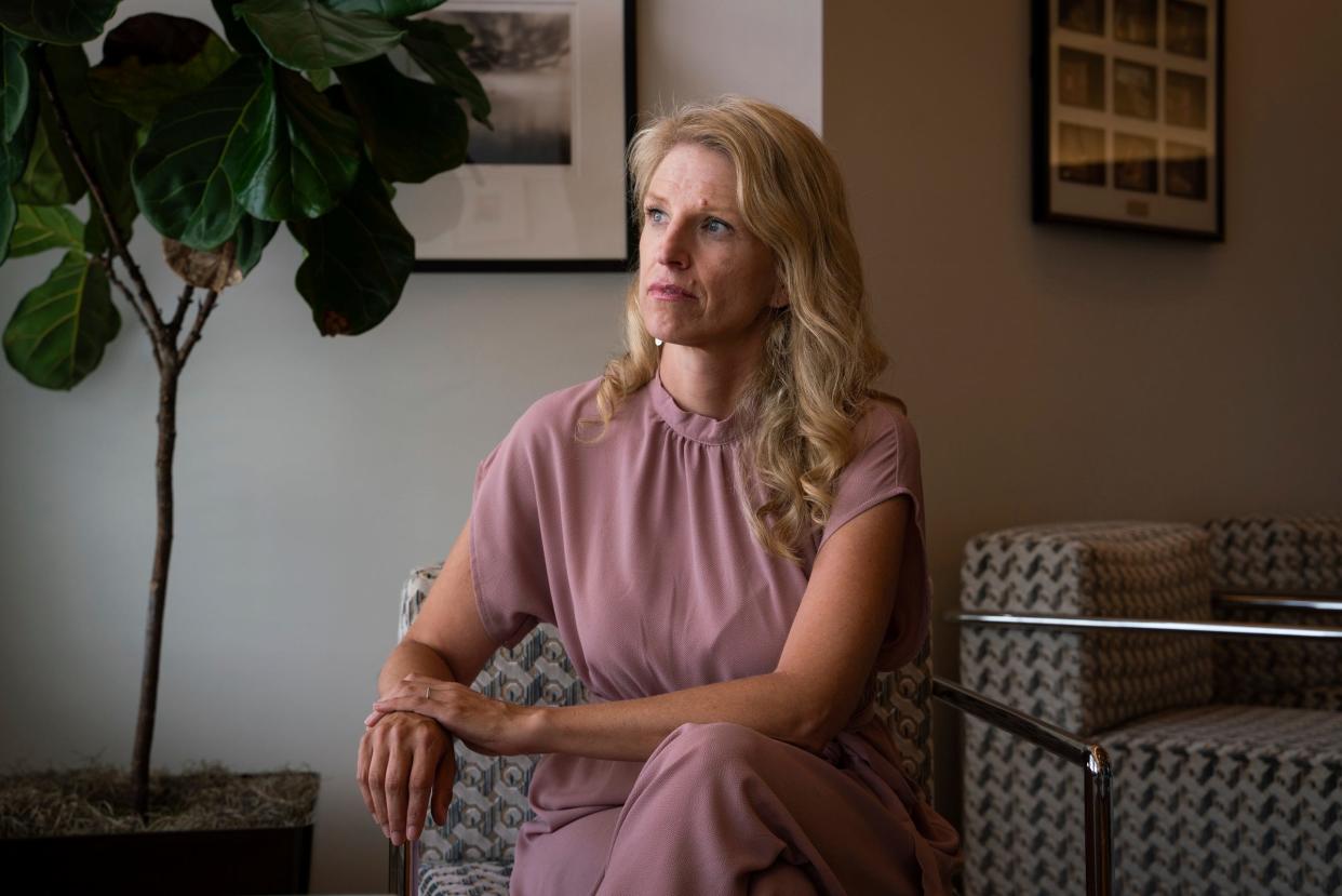 Jaime Nelson-Molnar, 44, of Ann Arbor, sits in her attorney's office in Royal Oak on July 14, 2023. “Anyone should help a child saying ‘help!’ I don’t know how someone has it in their body to hear a child saying help and stand by and watch,” said Nelson-Molnar, whose son with autism was assaulted by a school bus aide when he was 7-years-old. Nelson-Molnar is now suing the Ann Arbor Public Schools over the incident.
