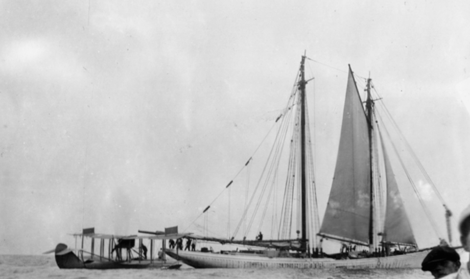 McCoy's schooner, the Arethusa (at right), offloads liquor to a waiting seaplane.