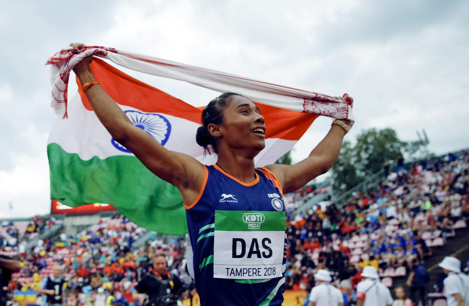Athletics - 2018 IAAF World U20 Championships – women's 400 metres – Tampere, Finland – July 12, 2018. Hima Das of India celebrates her victory. Lehtikuva/Kalle Parkkinen via REUTERS ATTENTION EDITORS - THIS IMAGE WAS PROVIDED BY A THIRD PARTY. NO THIRD PARTY SALES. NOT FOR USE BY REUTERS THIRD PARTY DISTRIBUTORS. FINLAND OUT. NO COMMERCIAL OR EDITORIAL SALES IN FINLAND.