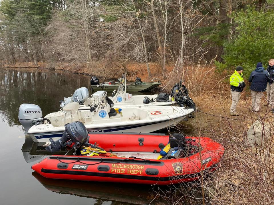 Boats being used to search the Sudbury Reservoir on Sunday in Southborough.