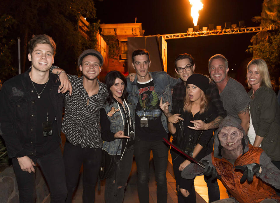 For some reason, Ashley Tisdale was the only one in a gang that included her husband Christopher French; '90210' star Shenae Grimes-Beech and her husband Josh Beech; and 5 Seconds of Summer’s Luke Hemmings and Ashton Irwin, to notice the stranger who crept into the bottom of the photo they snapped at Halloween Horror Nights. Smart girl! (Courtesy of NBC Universal)