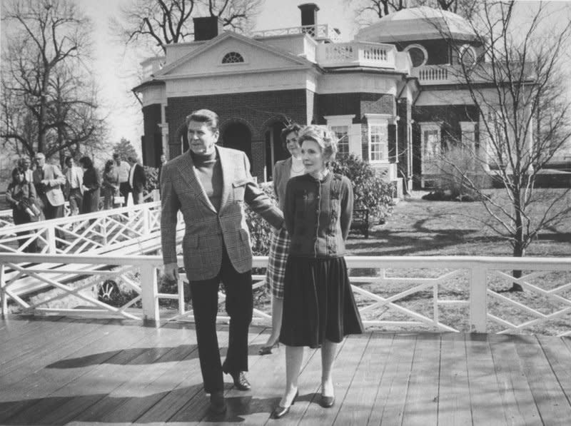 President Ronald Reagan and first lady Nancy Reagan stand outside Monticello, a UNESCO World Heritage Site, on March 24, 1984. On December 29, 1983, with the president's approval, the United States announced its withdrawal from UNESCO, charging the U.N. cultural and scientific organization was biased against Western nations. File Photo by Ron Bennett/UPI
