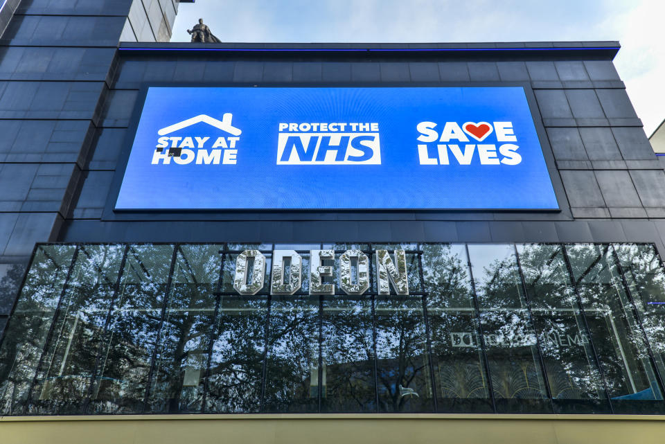 LONDON, UNITED KINGDOM - 2020/11/05: A digital display screen on the Odeon Luxe in Leicester Square showing a message saying Stay Home, Protect the NHS, Save Lives'. England has entered into the 2nd Lockdown due to the Pandemic. (Photo by Dave Rushen/SOPA Images/LightRocket via Getty Images)