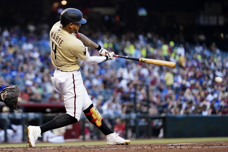 Arizona Diamondbacks' Ketel Marte connects for a single against the Los Angeles Dodgers during the third inning of a baseball game Saturday, Sept. 25, 2021, in Phoenix. (AP Photo/Ross D. Franklin)