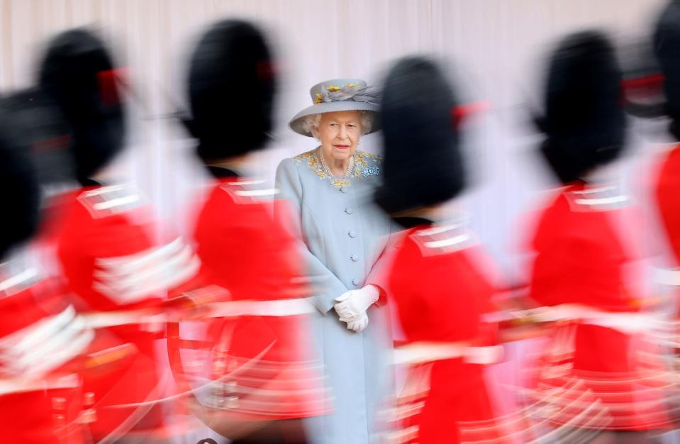 Soldiers pass Queen Elizabeth at Trooping the Colour in 2021