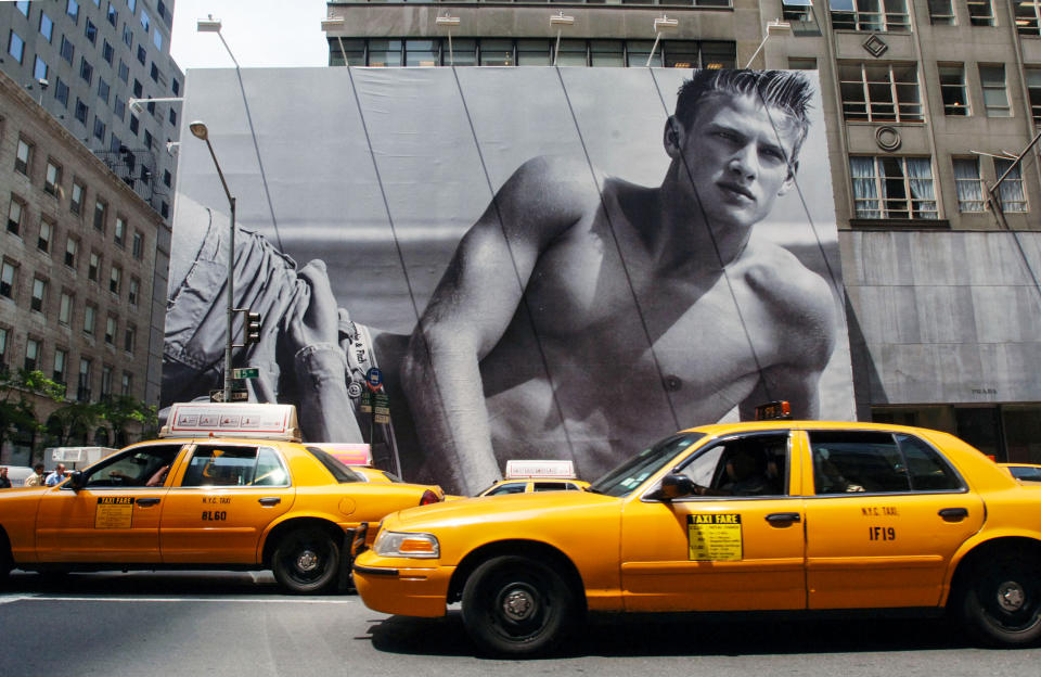 Cabs drive in front of a billboard surrounding the future home of a new Abercrombie & Fitch store on June 2, 2005 in New York. (Daniel Acker / Bloomberg via Getty Images)