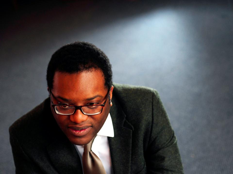 Prospective Conservative Party Parliamentary candidate, Kwasi Kwarteng, poses for pictures during a Reuters interview in his constituency offices in Staines, south west London March 9, 2010. A son of Ghanaian immigrants who was educated at Eton, Britain's most exclusive private school, parliamentary candidate Kwarteng embodies both change and continuity in the Conservative Party. An admirer of Margaret Thatcher, who as prime minister in the 1980s transformed Britain through free-market reforms, Kwarteng espouses the long-standing Conservative ideals of low taxes, a small state, strong defence and robust law and order. Photograph taken March 9, 2010. To match feature BRITAIN-ELECTION/CONSERVATIVE REUTERS/Toby Melville (BRITAIN - Tags: POLITICS ELECTIONS)