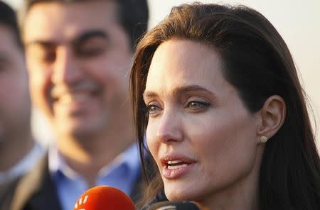 Actress and special envoy of the U.N. High Commissioner for Refugees (UNHCR) Angelina Jolie speaks to the media as she visits a Kurdish refugee camp in Dohuk, northern Iraq January 25, 2015. REUTERS/Ari Jalal/Files