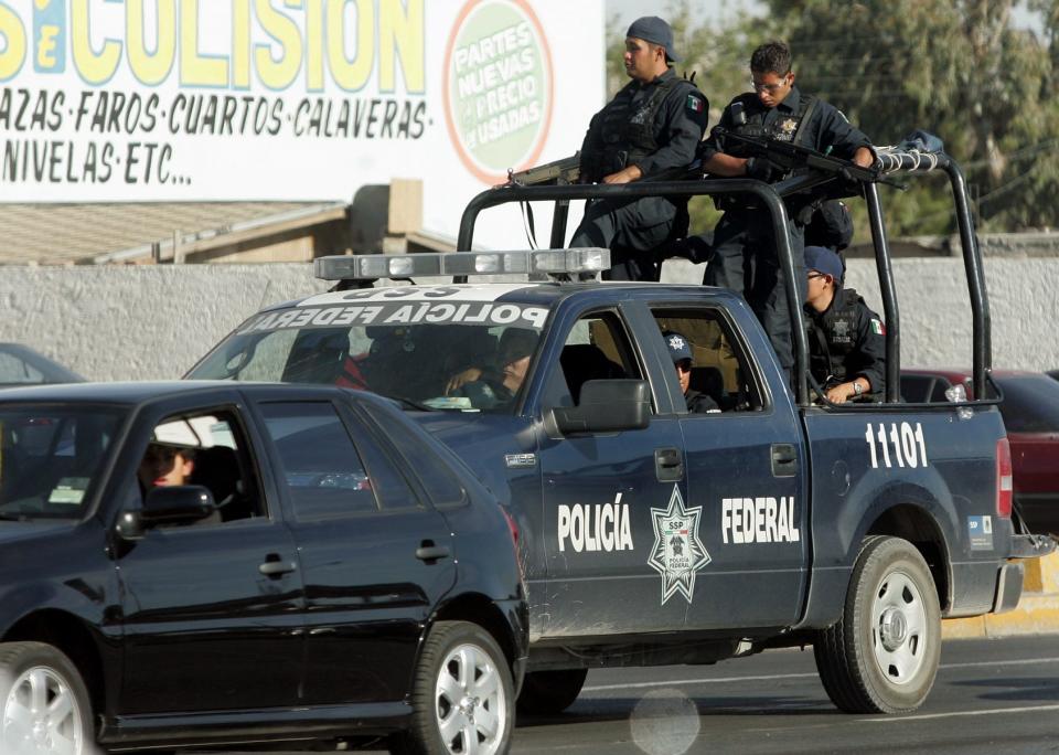 Mexican federal police patrol the streets of Juárez amid a rise in violence during a war between drug cartels in 2008.