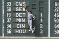 New York Yankees' Jake Bauers is unable to get his glove on an RBI single by Boston Red Sox's Justin Turner in the fifth inning of a baseball game, Sunday, June 18, 2023, in Boston. (AP Photo/Steven Senne)