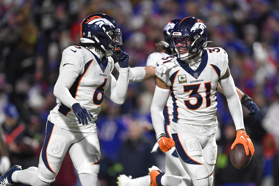 Denver Broncos' Justin Simmons (31) reacts after intercepting a pass thrown by Buffalo Bills quarterback Josh Allen during the first half of an NFL football game, Monday, Nov. 13, 2023, in Orchard Park, N.Y. (AP Photo/Adrian Kraus)