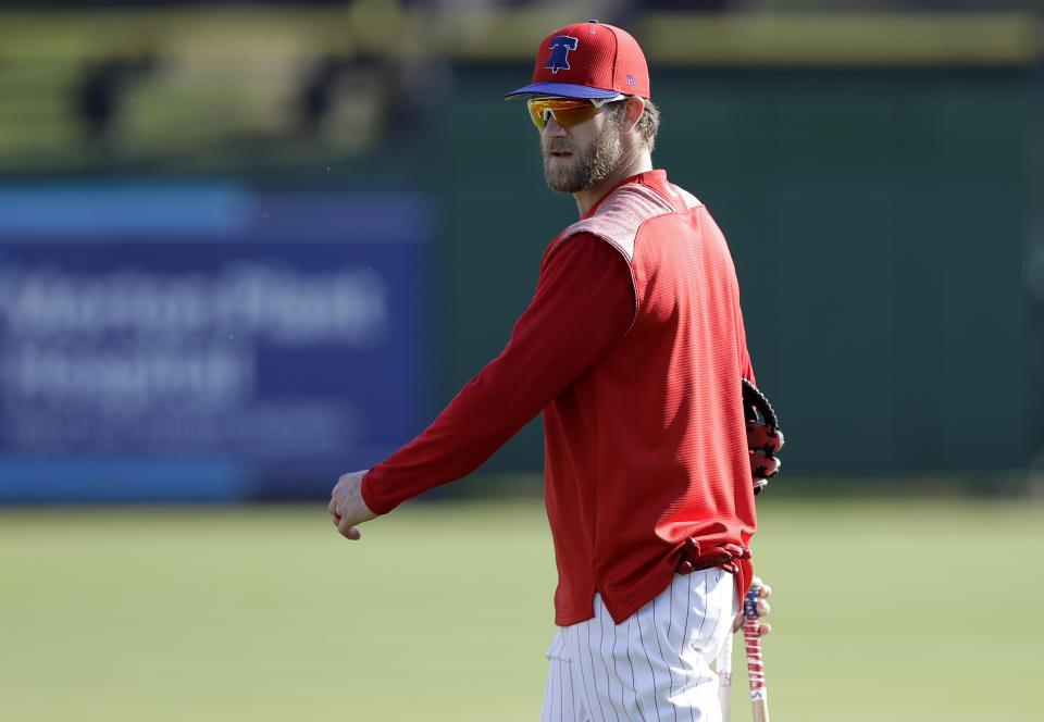 Philadelphia Phillies' Bryce Harper walks off the field after taking batting practice before a spring training baseball game against the Tampa Bay Rays Monday, March 11, 2019, in Clearwater, Fla. (AP Photo/Chris O'Meara)