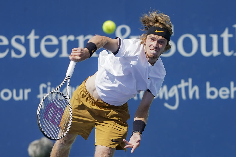 Andrey Rublev, of Russia, serves to Roger Federer, of Switzerland, during the quarterfinals of the Western & Southern Open tennis tournament, Thursday, Aug. 15, 2019, in Mason, Ohio. (AP Photo/John Minchillo)