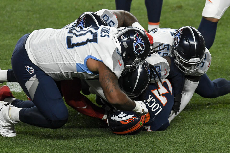 Drew Lock (3) of the Denver Broncos is sacked by Jadeveon Clowney of the Tennessee Titans. (Photo by AAron Ontiveroz/MediaNews Group/The Denver Post via Getty Images)