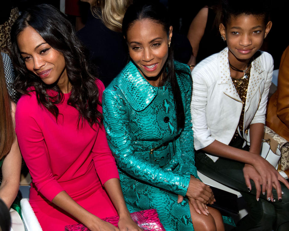 Actresses Zoe Saladana, left, Jada Pinkett Smith and Willow Smith, right, attend the Fall 2013 Michael Kors Runway Show, on Wednesday, Feb. 13, 2013 in New York. (Photo by Dario Cantatore/Invision/AP)