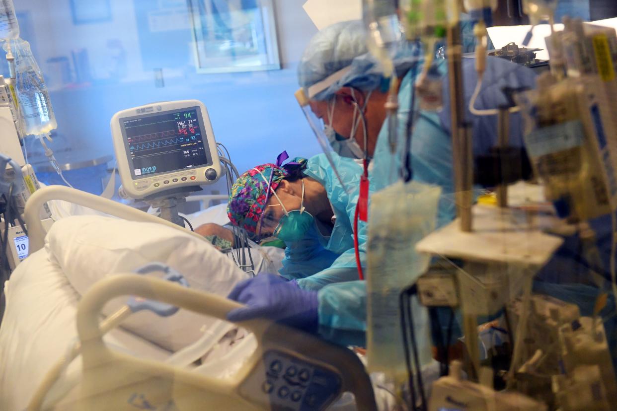 Medical staff attend to one of 28 COVID-19 patients on Friday, Aug. 20, 2021, in the Surgical Intensive Care Unit at Cleveland Clinic Indian River Hospital in Vero Beach. The unit has been transitioned to treat the surge of patients over the last month. All patients currently in the SICU are on ventilators.