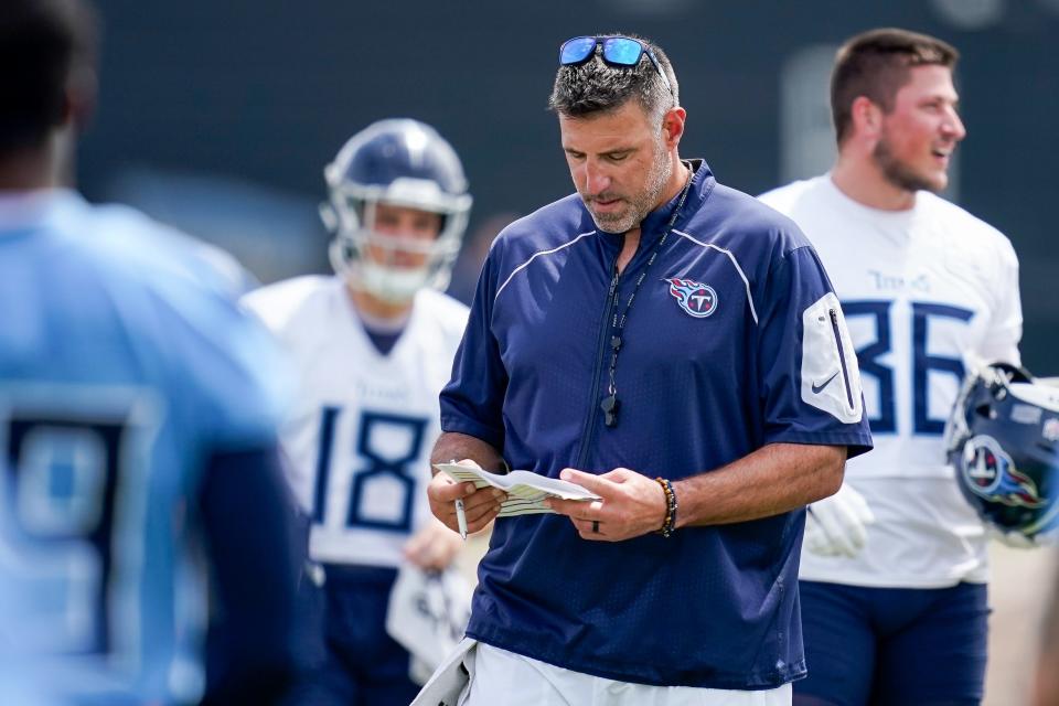 Tennessee Titans coach Mike Vrabel works with his team during an OTA practice June 14 at Ascension Saint Thomas Sports Park in Nashville, Tenn.