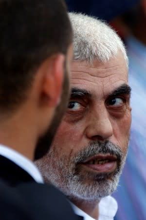 Hamas Gaza Chief Yehya Al-Sinwar looks on as he takes part in a protest against Bahrain's workshop for U.S. Middle East peace plan, in Gaza City