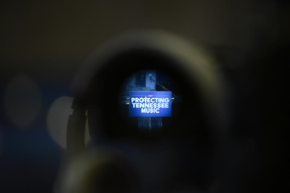 A video camera sits ready with its lens on the podium message before Tennessee Governor Bill Lee unveiled new legislation designed to protect songwriters, performers and other music industry professionals against the potential dangers of artificial intelligence. (AP Photo/John Amis)