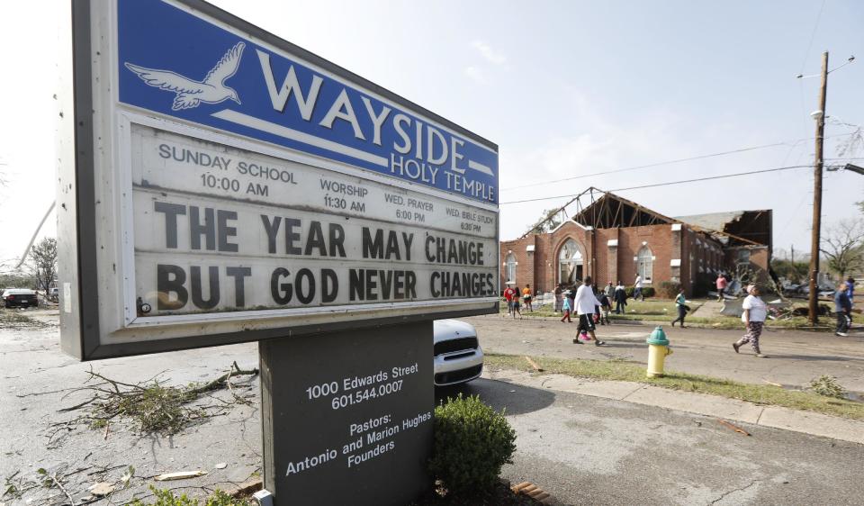 A church's message seem prophetic for the damage suffered in south Mississippi, including Hattiesburg, when a deadly tornado hit the southern part of town, early Saturday, Jan. 21, 2017. The tornado was part of a wall of stormy weather traveling across the region, bringing with it rain and unstable conditions. (AP Photo/Rogelio V. Solis)