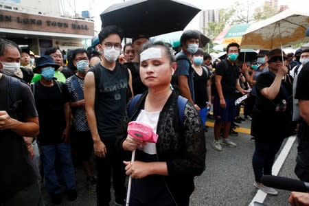 Demonstrators march to protest against the Yuen Long attacks in Yuen Long