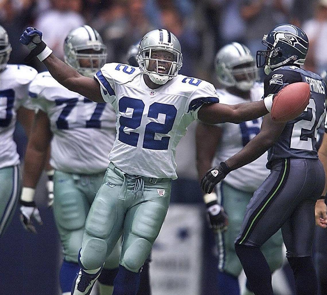 Dallas Cowboys running back Emmitt Smith celebrates after breaking the NFL’s all-time rushing record in 2002.