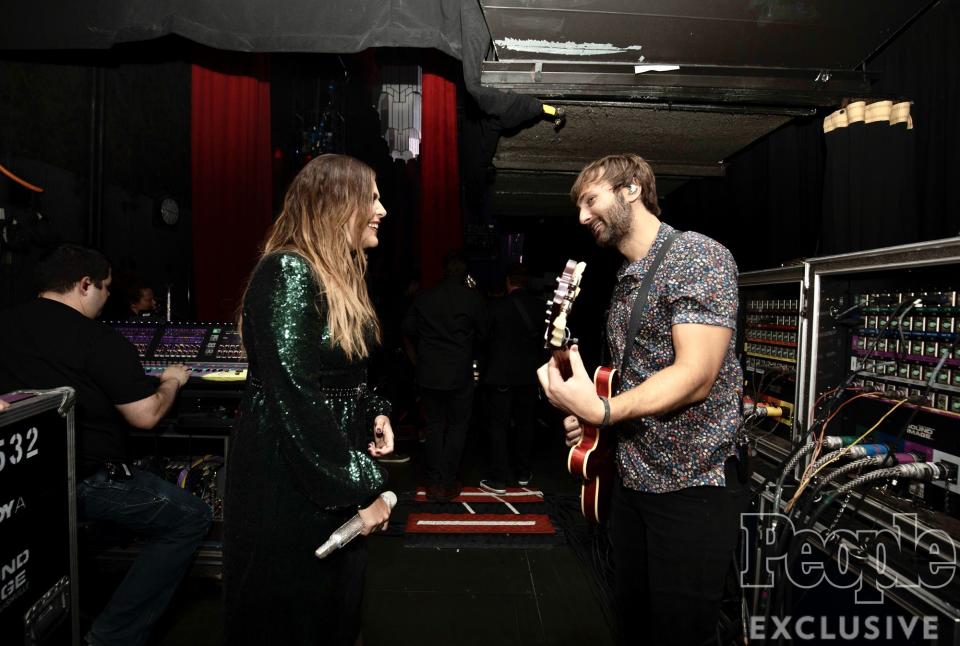 Hillary Scott and Dave Haywood share a quick moment before stepping onto stage.