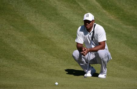 Feb 16, 2018; Pacific Palisades, CA, USA; Tiger Woods lines up a putt on the second green during the second round of the Genesis Open golf tournament at Riviera Country Club. Mandatory Credit: Orlando Ramirez-USA TODAY Sports