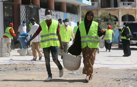 Construction workers are seen as they take part in the renovation project of Somalia's National Theatre in Mogadishu, Somalia February 3, 2019. Picture taken February 3, 2019. REUTERS/Feisal Omar