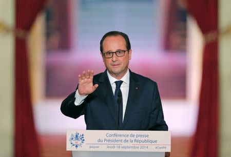 French President Francois Hollande addresses a news conference at the Elysee Palace in Paris, September 18, 2014. REUTERS/Christian Hartmann