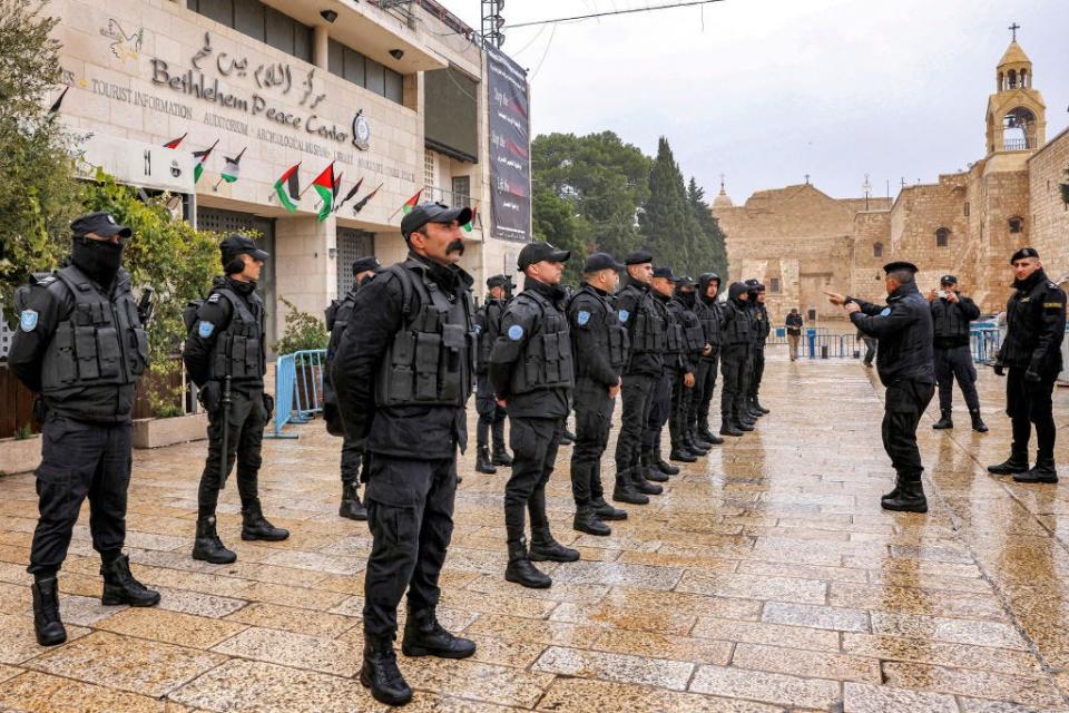 Palestinian policemen deploy in the Manger Square outside the Church of the Nativity in Bethlehem