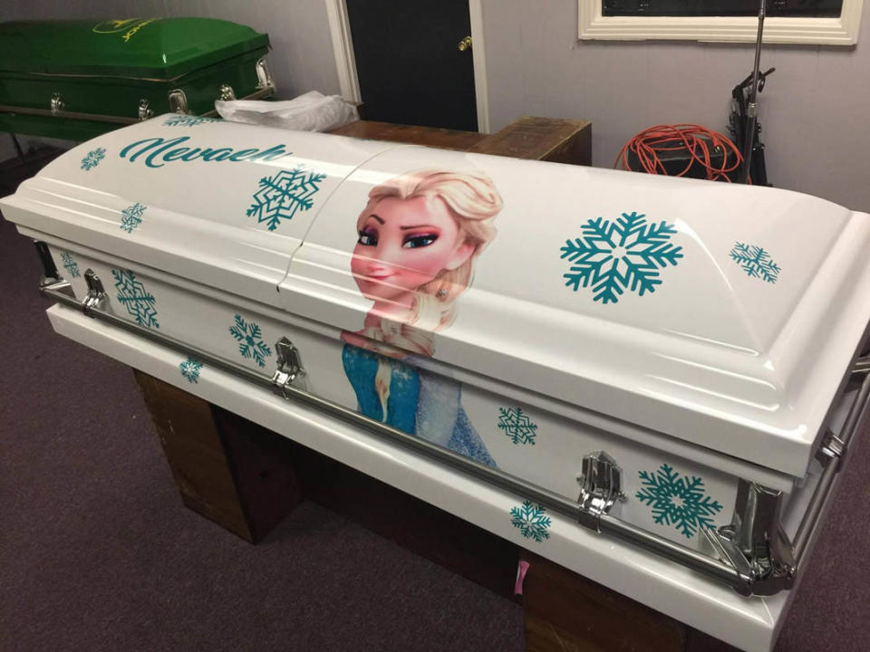 a photo of a blue and white frozen casket with elsa on the front