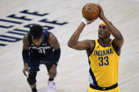 Indiana Pacers center Myles Turner (33) shoots a free throw in front of Orlando Magic guard Terrence Ross (31) during the second half of an NBA basketball game in Indianapolis, Friday, Jan. 22, 2021. AP Photo/AJ Mast)