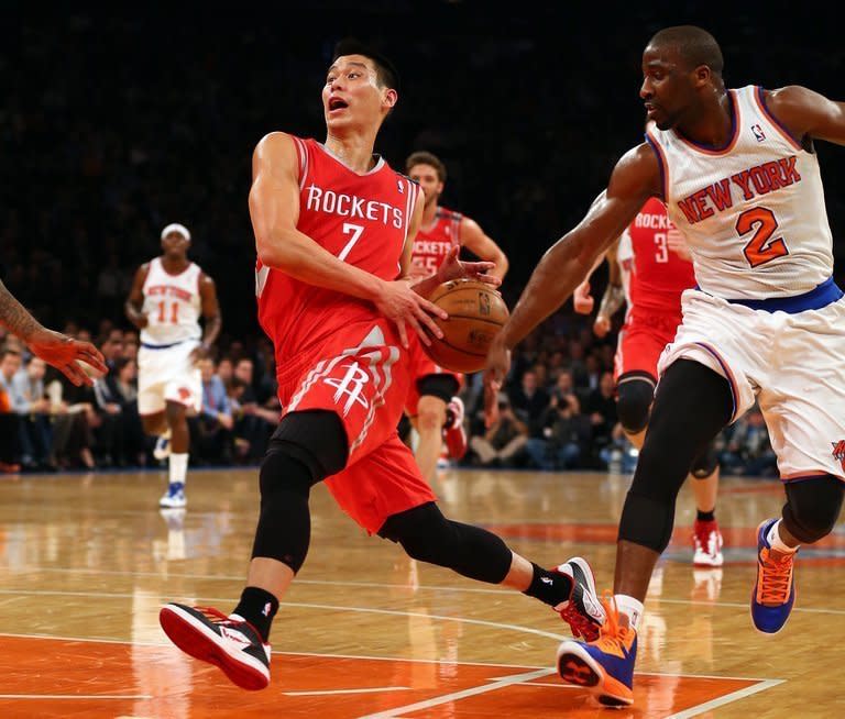 Jeremy Lin of the Houston Rockets heads for the net as Raymond Felton of the New York Knicks defends on December 17, 2012 at Madison Square Garden in New York City. Lin finished with 22 points and eight assists as Houston beat the Knicks 109-96, handing his former team their first home loss of the season